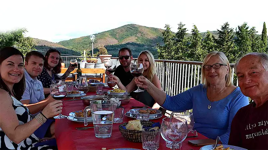 Girl waiting to taste the glass of red Chianti a winemaker is pouring her
