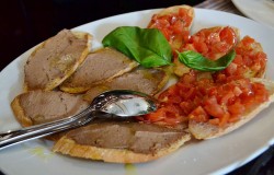 Bruschetta topped with fresh tomatoes 